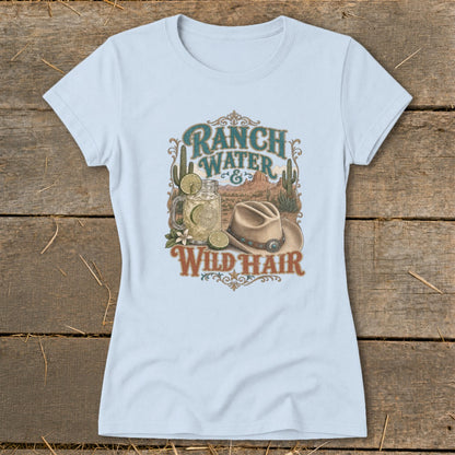 Light blue t-shirt with graphic: "Ranch Water & Wild Hair," drink, cowboy hat, cacti, and desert landscape.