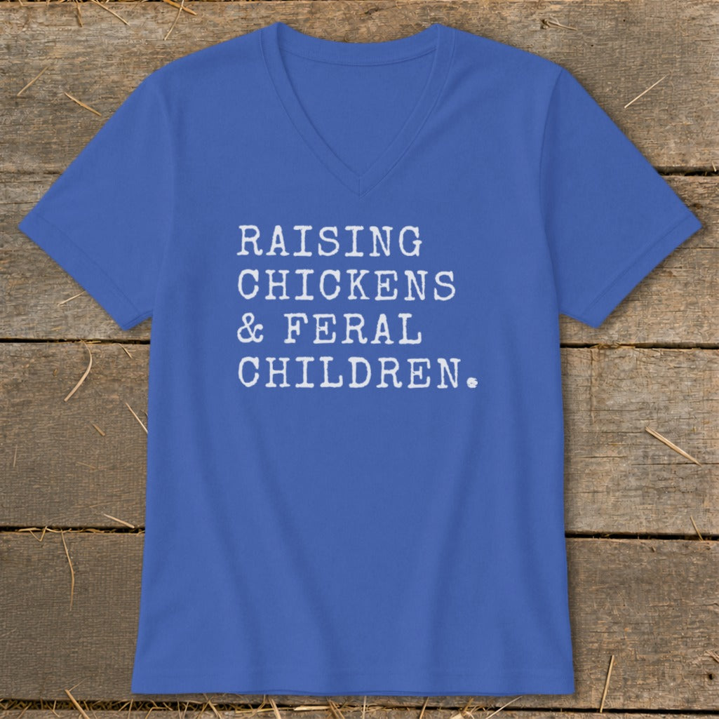 Blue v-neck t-shirt with white text: "Raising Chickens & Feral Children."