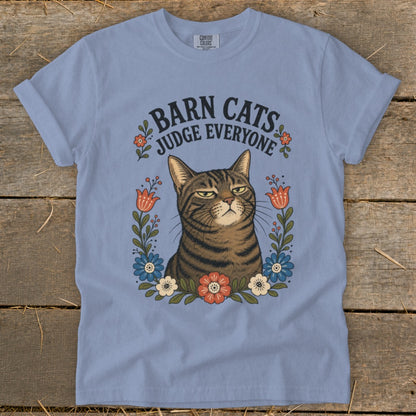 Light blue t-shirt with a tabby cat and the text "Barn Cats Judge Everyone".