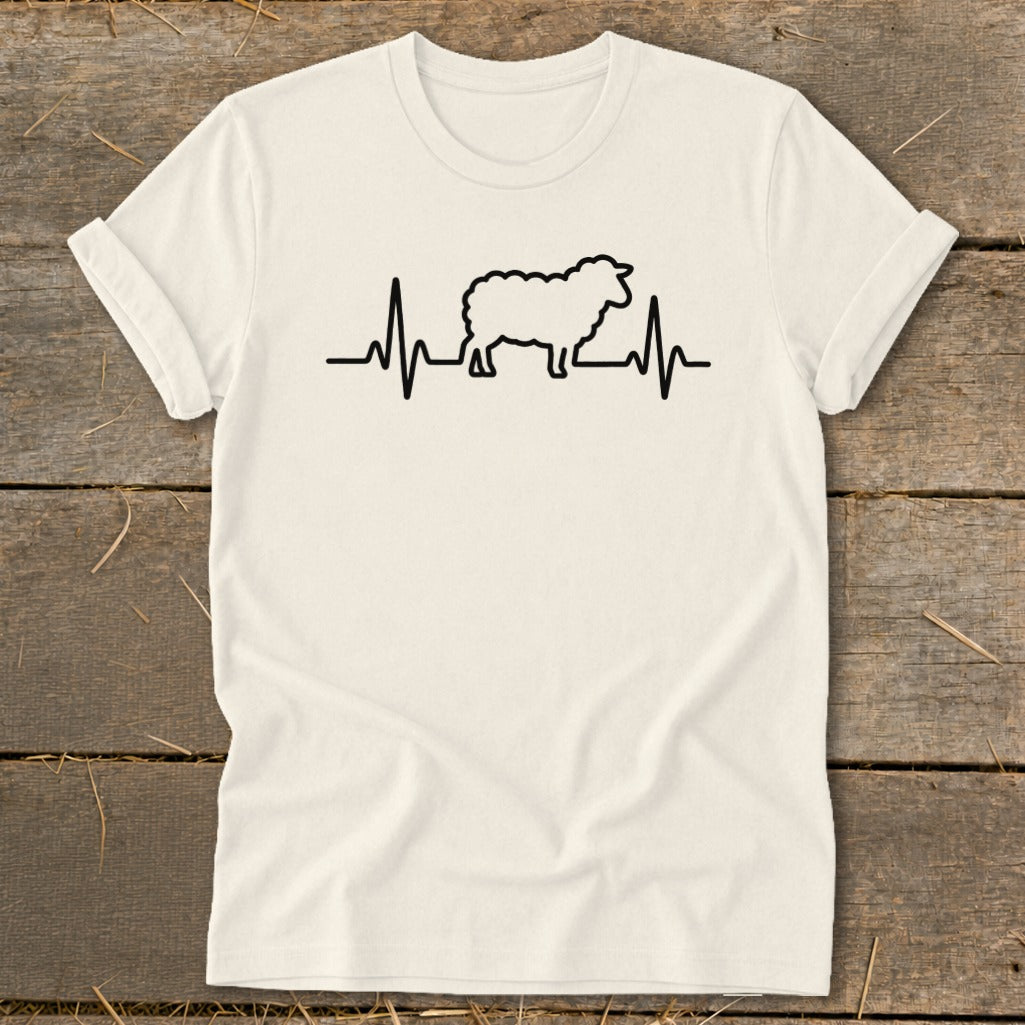A cream-colored t-shirt with a black graphic of a sheep integrated into a heartbeat line.