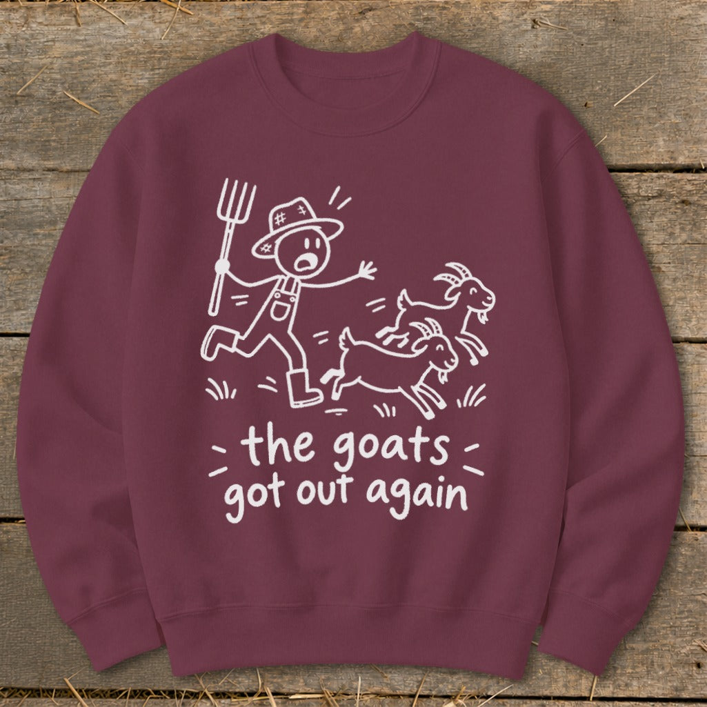 Maroon sweatshirt with white line art of a farmer chasing goats and text "the goats got out again".