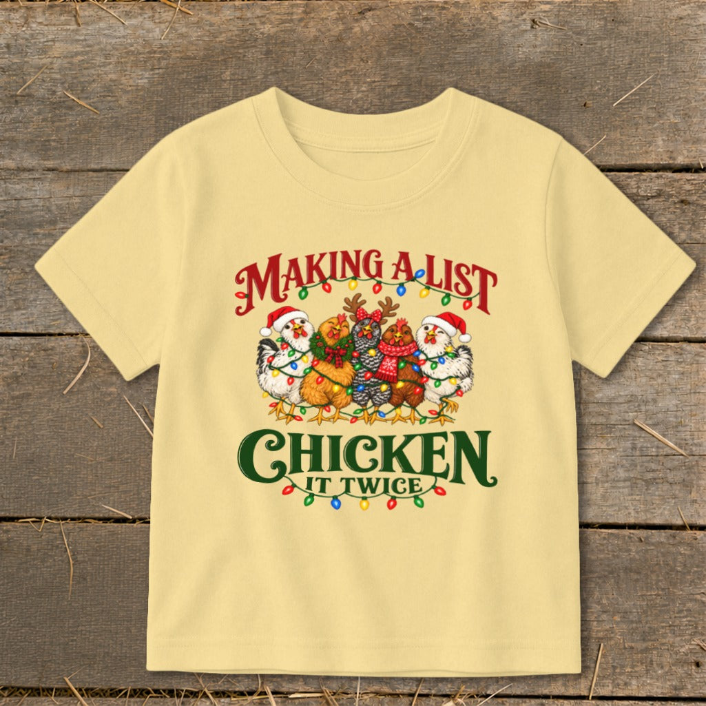 T-shirt with chickens in Santa hats and Christmas lights, reads "Making a list, chicken it twice."