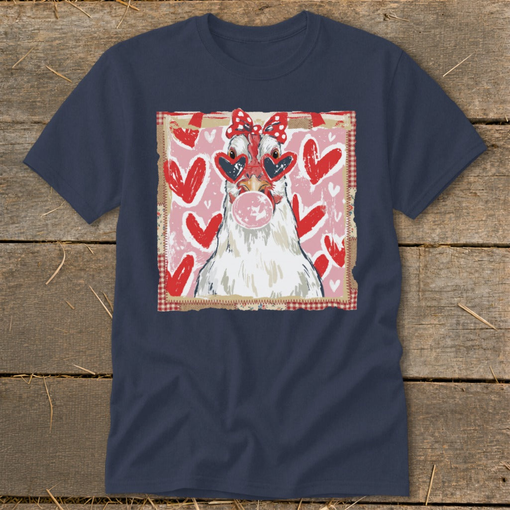 Chicken with heart sunglasses blowing bubblegum on a navy t-shirt with hearts.