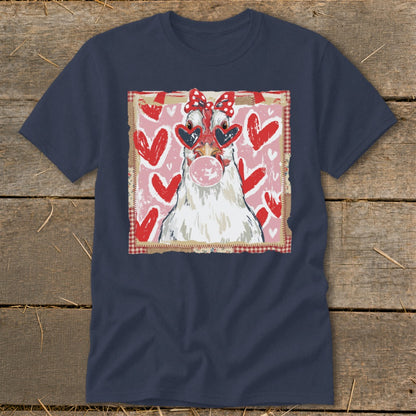 Chicken with heart sunglasses blowing bubblegum on a navy t-shirt with hearts.