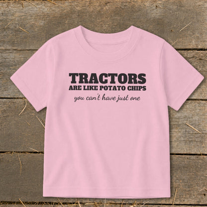 Pink t-shirt with text "TRACTORS ARE LIKE POTATO CHIPS you can't have just one".