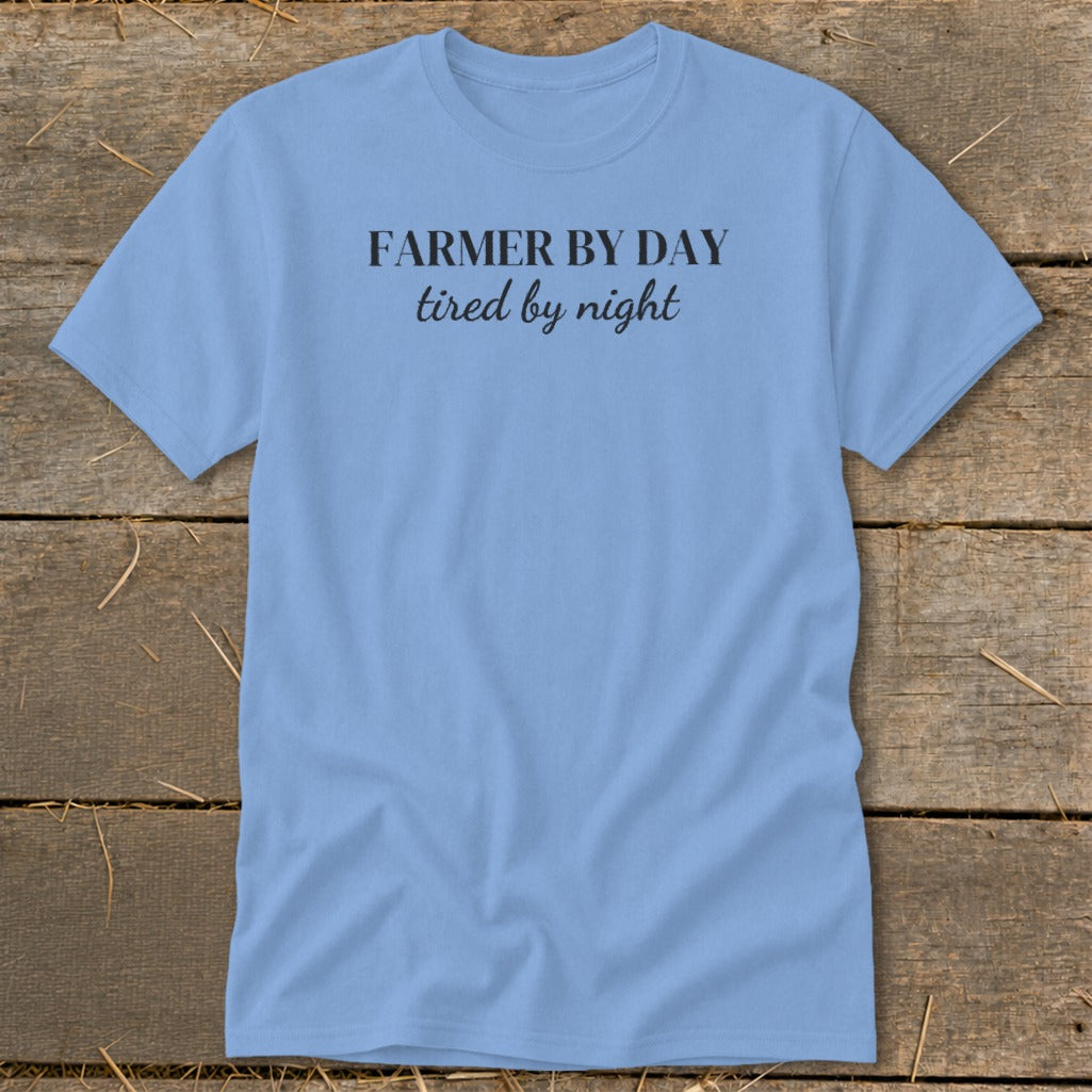 Light blue t-shirt with black text "FARMER BY DAY tired by night."