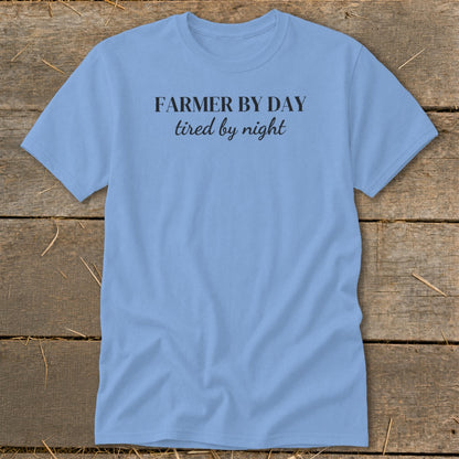 Light blue t-shirt with black text "FARMER BY DAY tired by night."