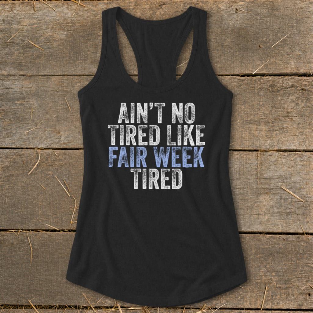 Black tank top with "Ain't No Tired Like Fair Week Tired" graphic