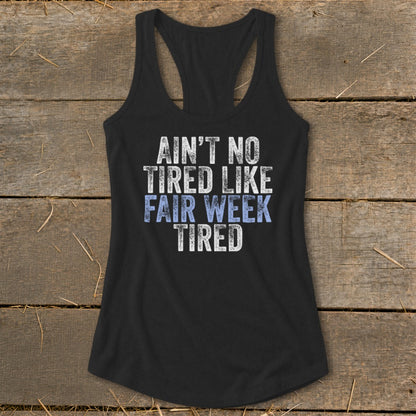 Black tank top with "Ain't No Tired Like Fair Week Tired" graphic