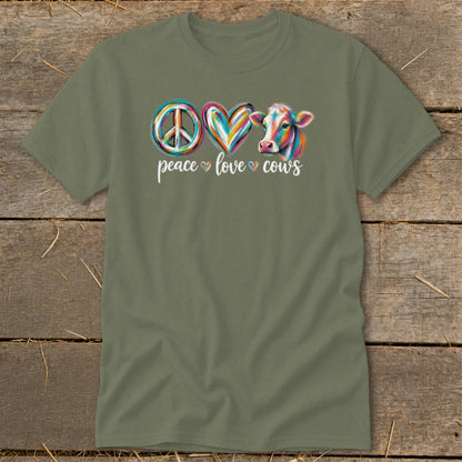 Green t-shirt with peace sign, heart, and colorful cow graphic and text.