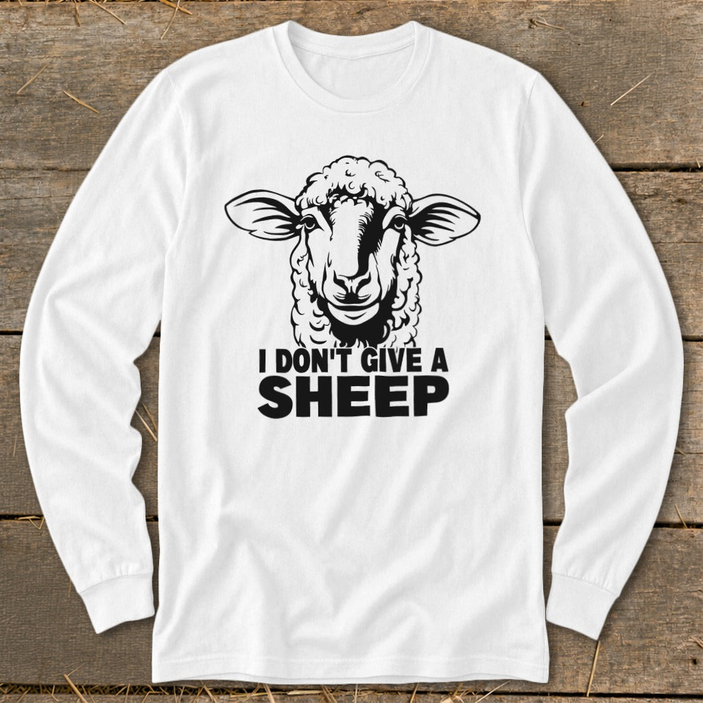 White long-sleeve shirt with a black graphic of a sheep's head and "I DON'T GIVE A SHEEP" text.