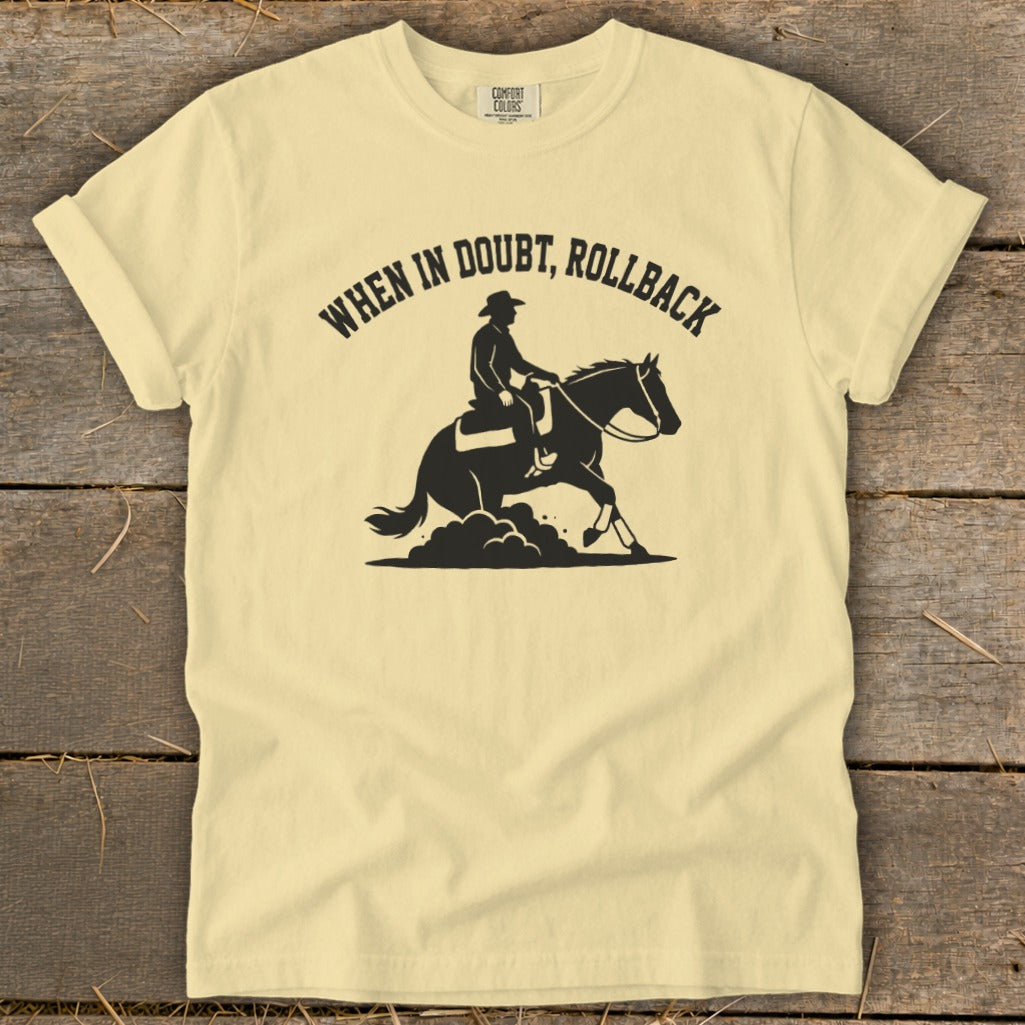 Pale yellow t-shirt with black silhouette of cowboy on horse and text "When in Doubt, Rollback".