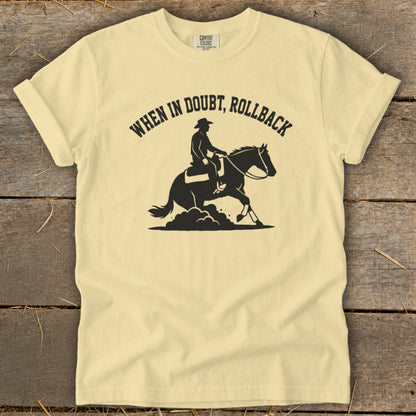 Pale yellow t-shirt with black silhouette of cowboy on horse and text "When in Doubt, Rollback".