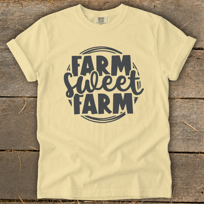 Yellow t-shirt with dark gray "Farm Sweet Farm" text in a circular design.