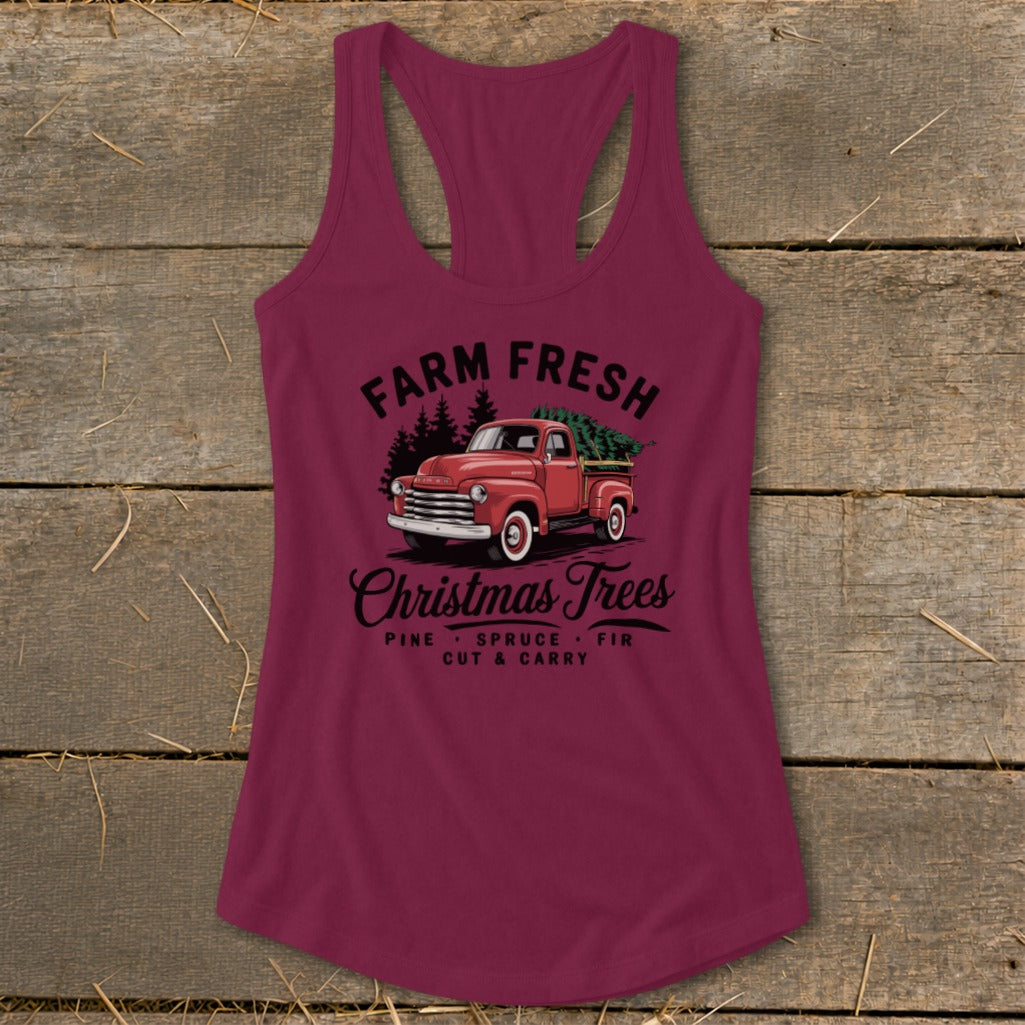 Maroon tank top with "Farm Fresh Christmas Trees" text and vintage red truck graphic.