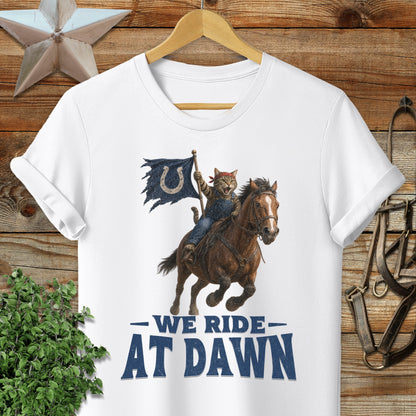 Cat wearing bandana riding horse with flag, "WE RIDE AT DAWN".