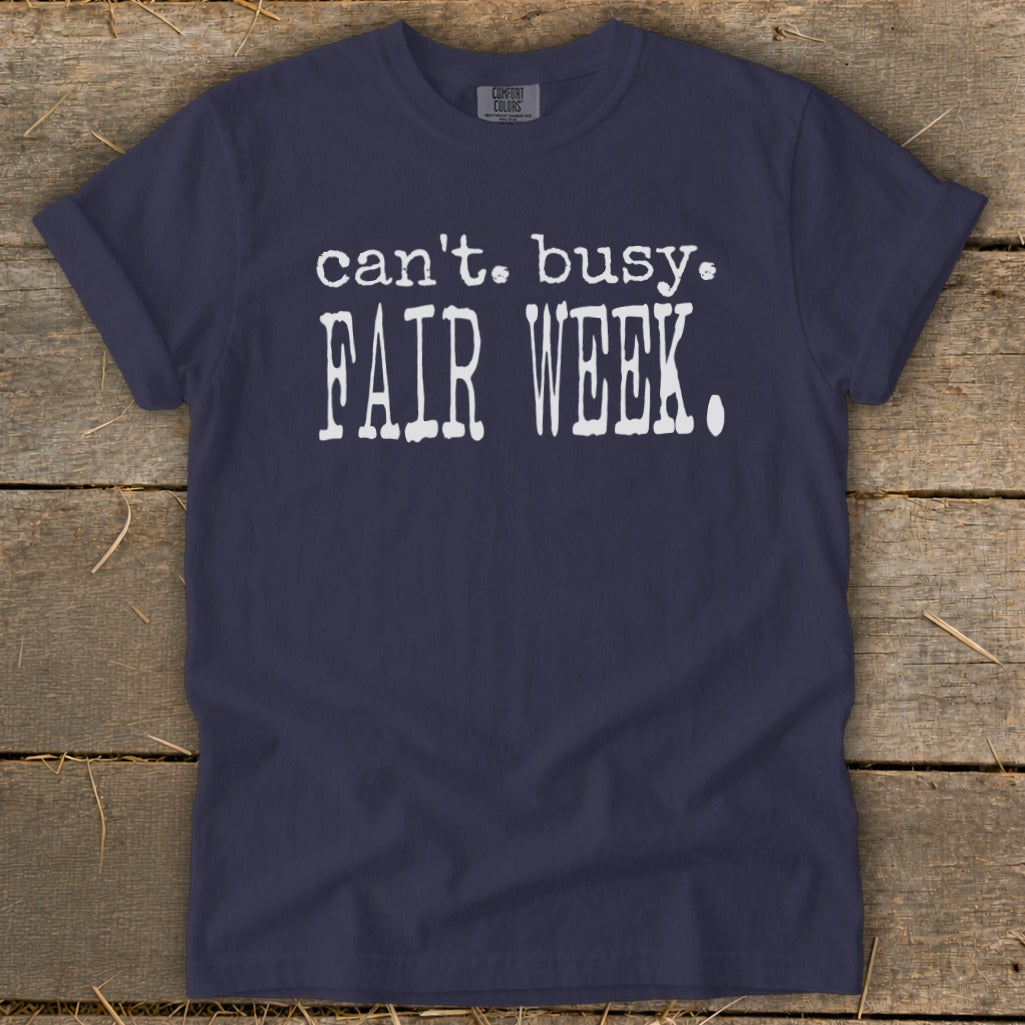 Navy t-shirt with white text reading "can't. busy. FAIR WEEK."
