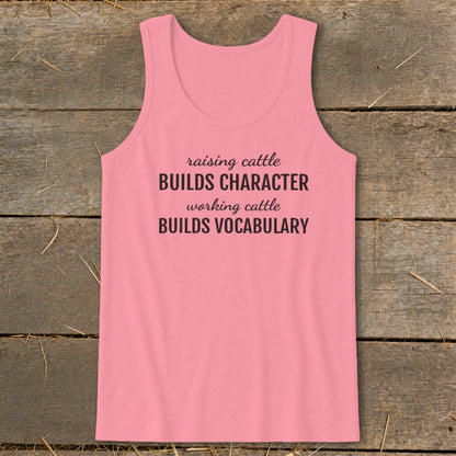 Pink tank top with "raising cattle BUILDS CHARACTER, working cattle BUILDS VOCABULARY" text.