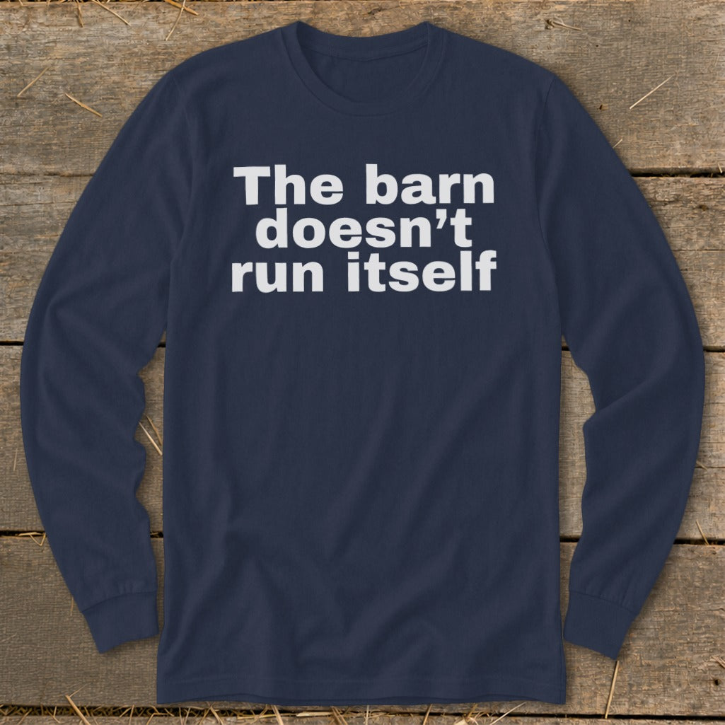Navy long sleeve shirt with white text reading "The barn doesn't run itself".