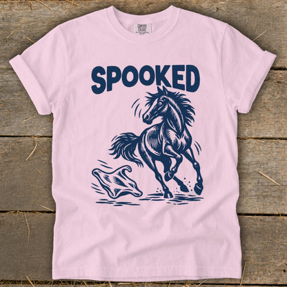 Pink t-shirt with navy blue graphic of a spooked horse running from a ghost.