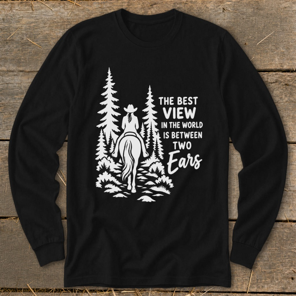 A black long-sleeved shirt with a white graphic of a person riding a horse through the forest, accompanied by text.