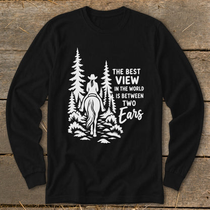 A black long-sleeved shirt with a white graphic of a person riding a horse through the forest, accompanied by text.