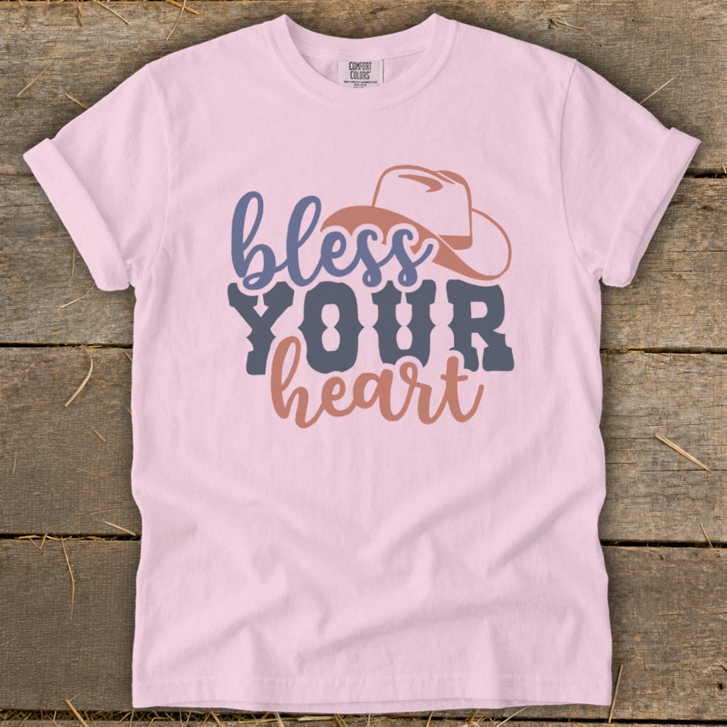 Light pink t-shirt with "bless YOUR heart" text and cowboy hat graphic.
