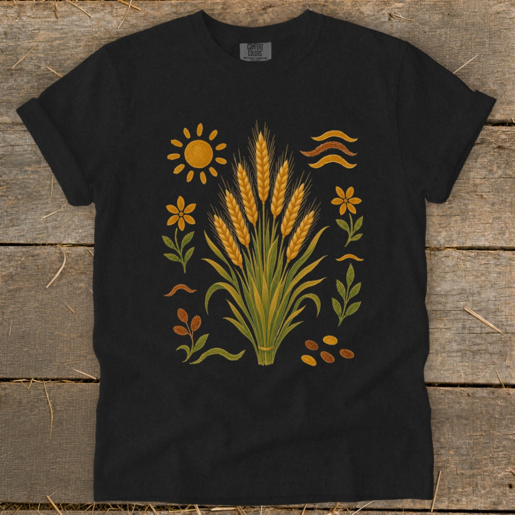Black t-shirt with wheat stalks, sun, flowers, leaves, and seeds design.