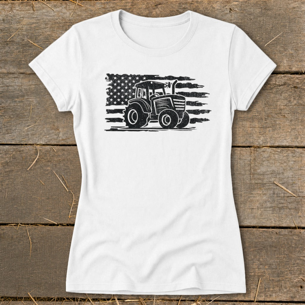 White t-shirt with a distressed tractor and American flag graphic.
