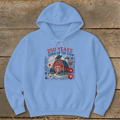 Light blue hoodie with a graphic of a red barn, silo, eagle, and flowers.