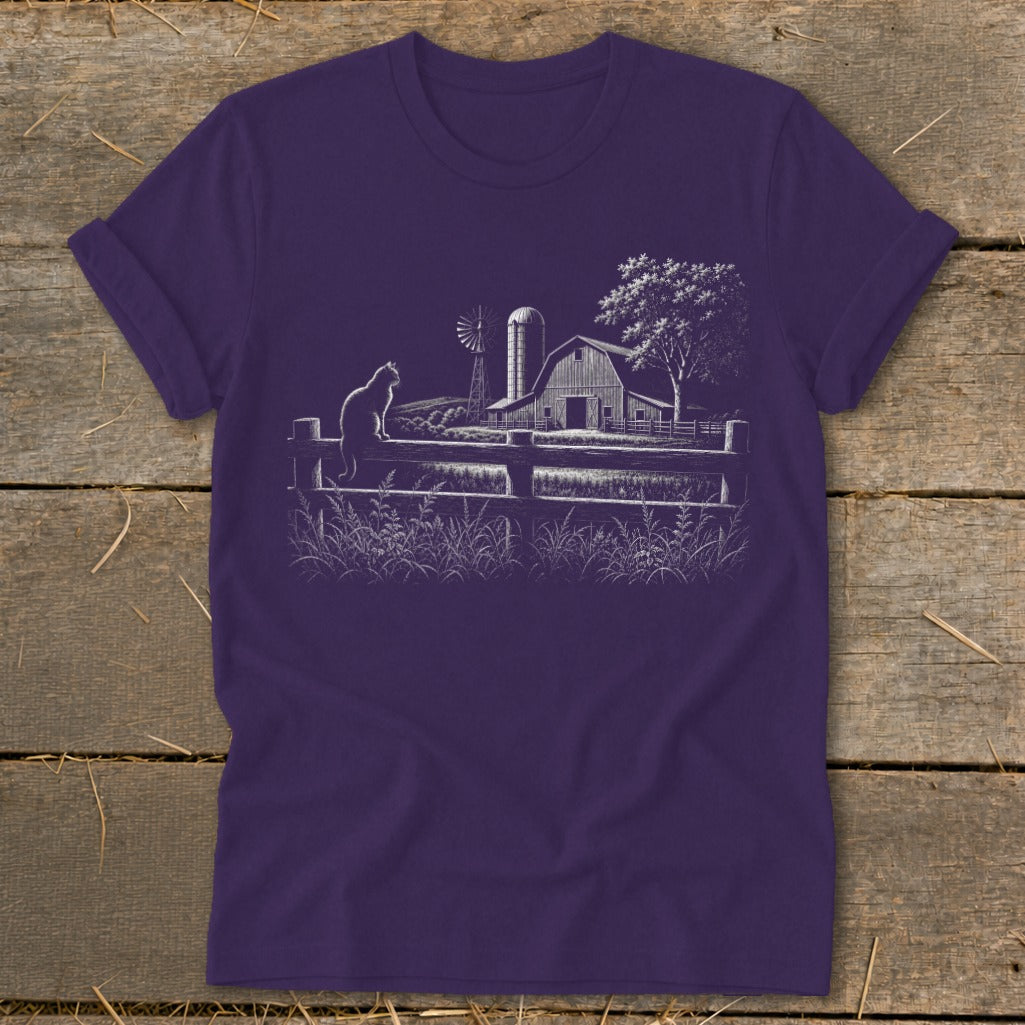 White line drawing of a farm scene with a cat on a fence on a purple t-shirt.
