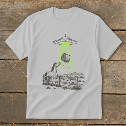 UFO abducting hay bale with horse watching in a field.