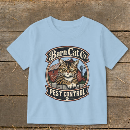 Light blue t-shirt featuring a circular graphic with a tabby cat, barn, and text reading Barn Cat Co Pest Control.
