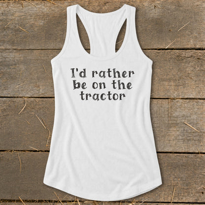 White tank top with black text that says "I'd rather be on the tractor".