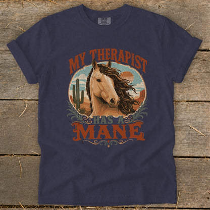 Navy t-shirt with a circular graphic of a horse's head and desert scene, reading "My Therapist Has a Mane".