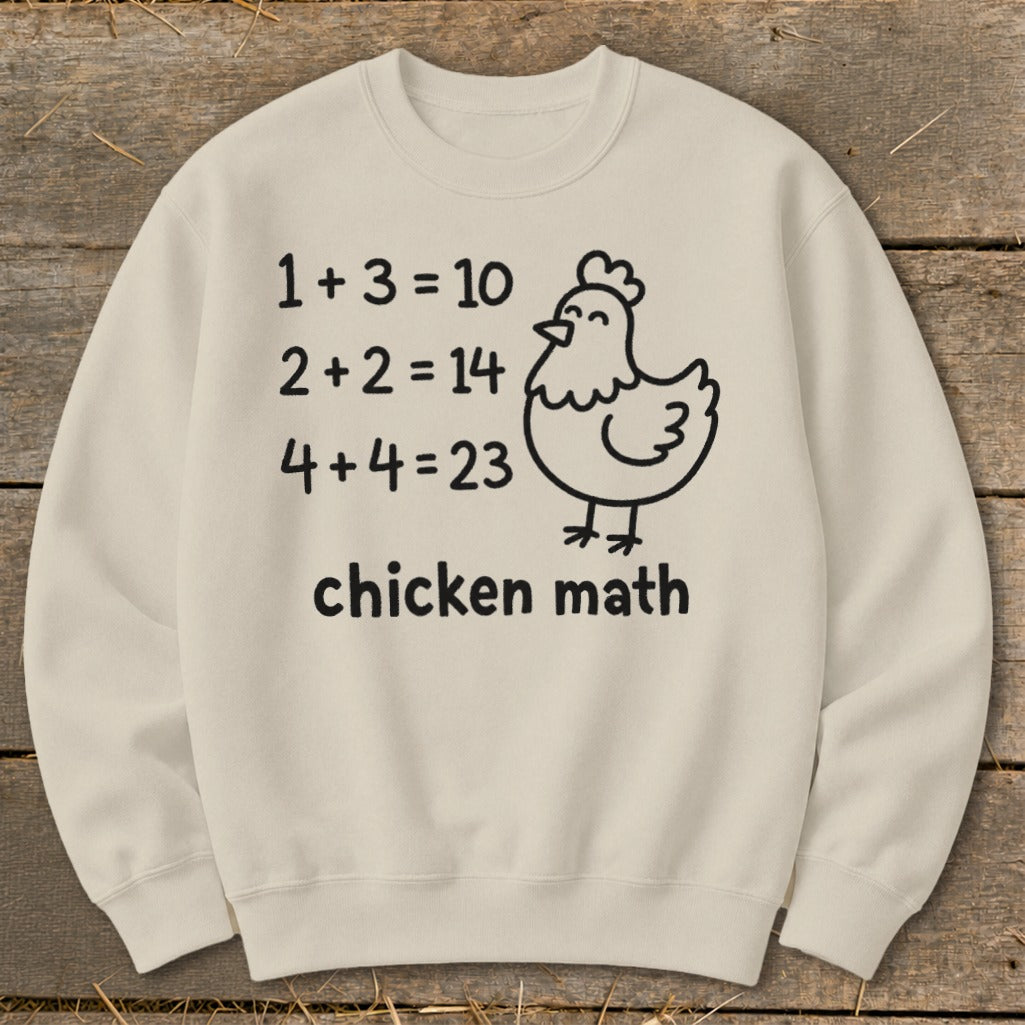 Cream sweatshirt with "chicken math" text and a cartoon chicken graphic.