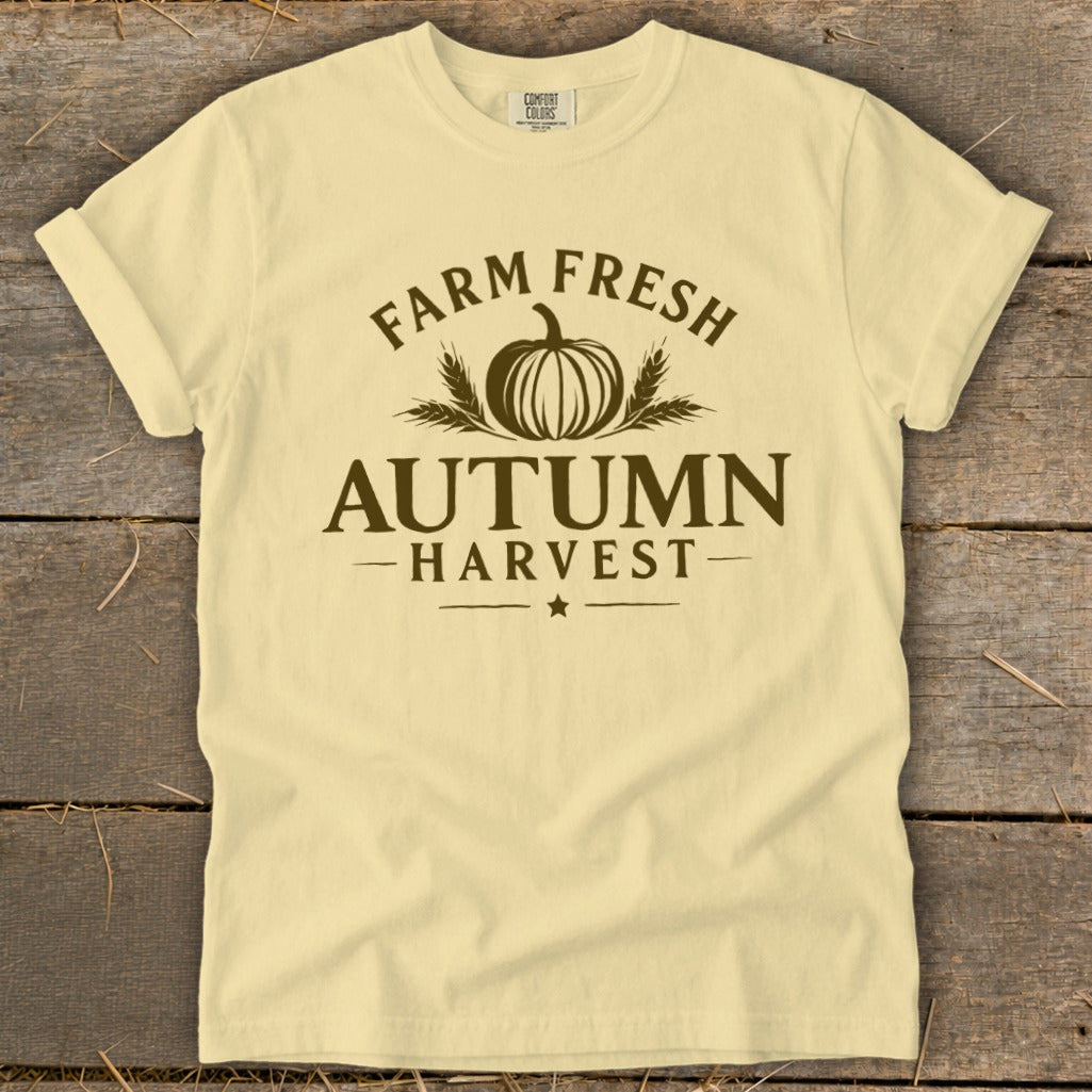 Light yellow t-shirt with "Farm Fresh Autumn Harvest" text and pumpkin graphic.