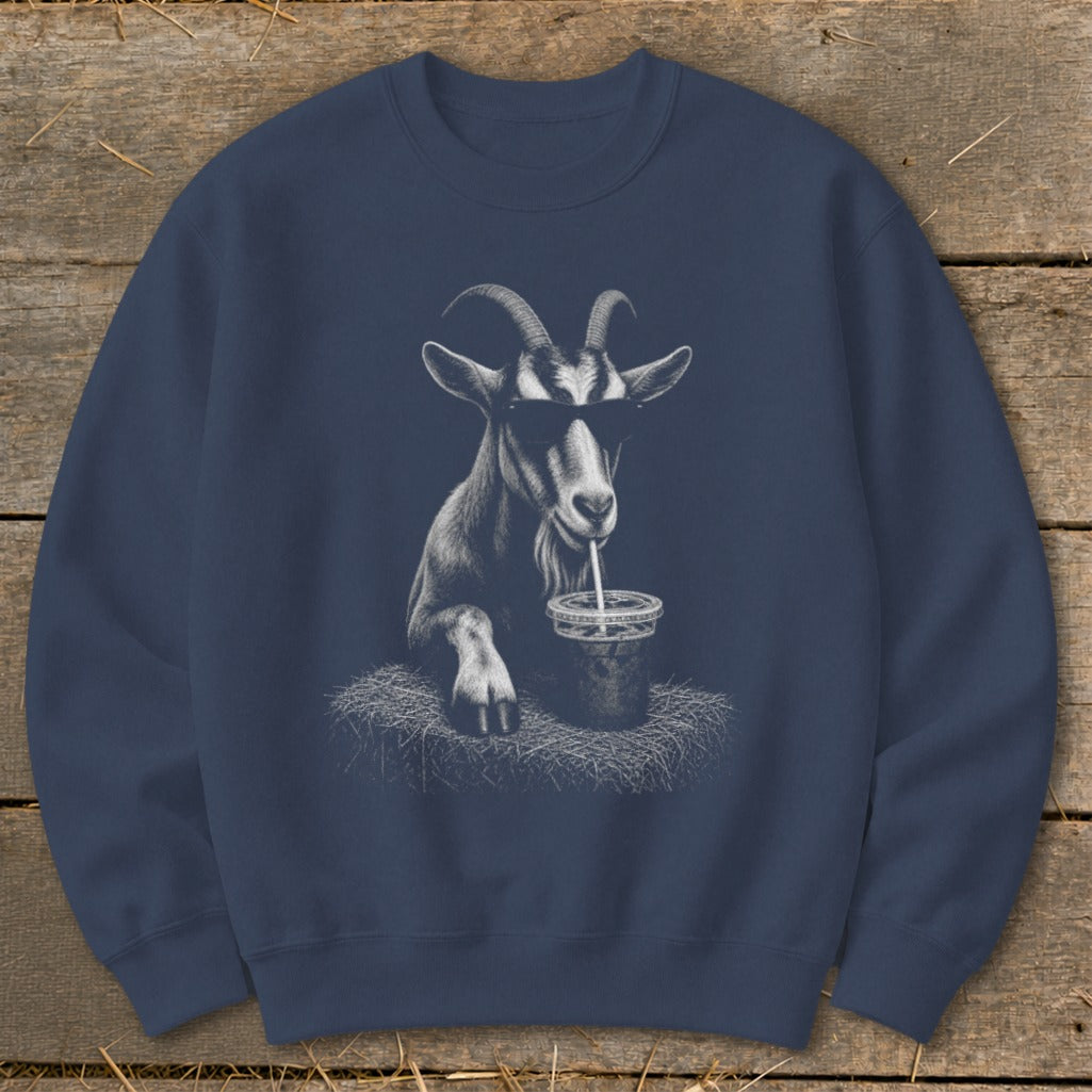 Goat wearing sunglasses sips from a drink on a navy sweatshirt.