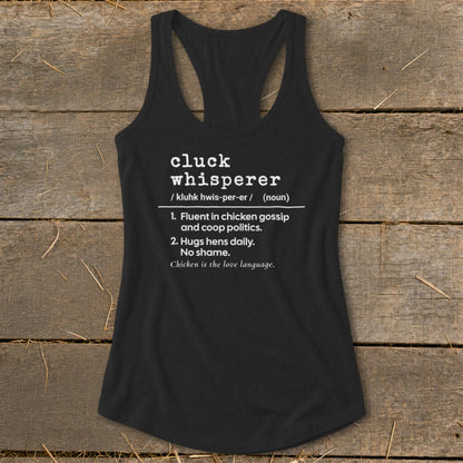 Black tank top with "Cluck Whisperer" definition: fluent in chicken gossip and coop politics.