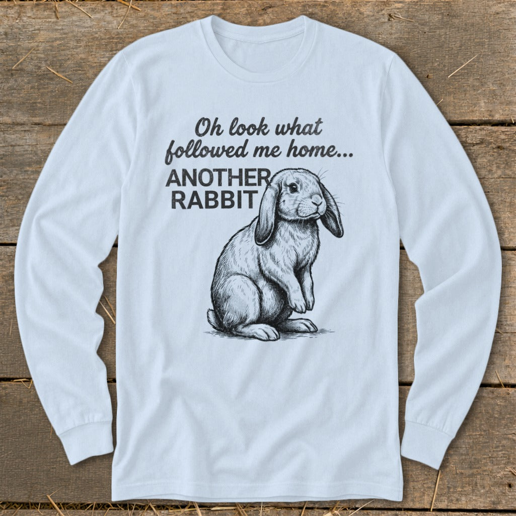 Light blue long-sleeve shirt with a sketch of a rabbit and text "Oh look what followed me home... ANOTHER RABBIT".