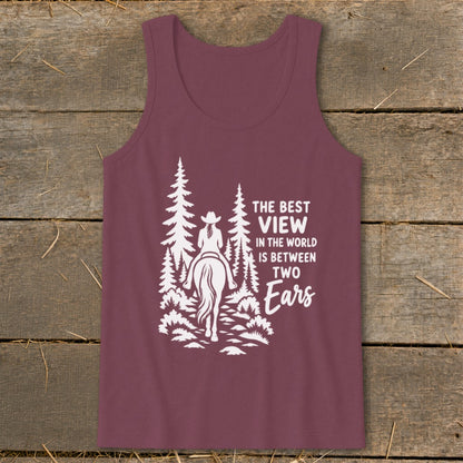 Maroon women's tank top with a white graphic of a horseback rider and pine trees, accompanied by the text The Best View in the World is Between Two Ears.