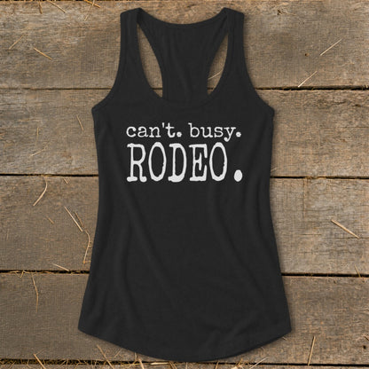 Black racerback tank top with white text that reads "can't. busy. RODEO."