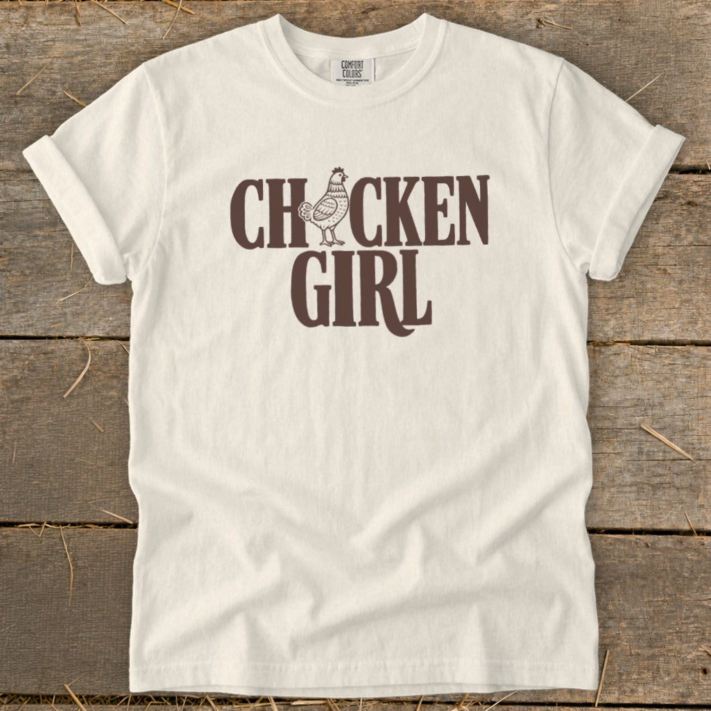 Cream t-shirt with "CHICKEN GIRL" text and a cartoon chicken graphic.