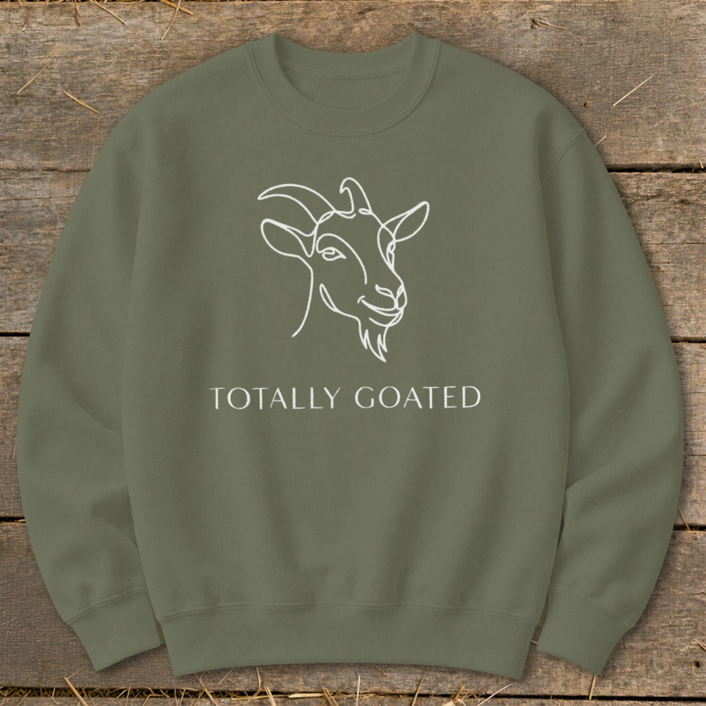 Green sweatshirt with white line art goat and "TOTALLY GOATED" text.