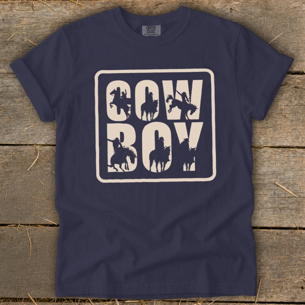 Navy t-shirt with "Cowboy" text and cowboy silhouettes within a rectangle.
