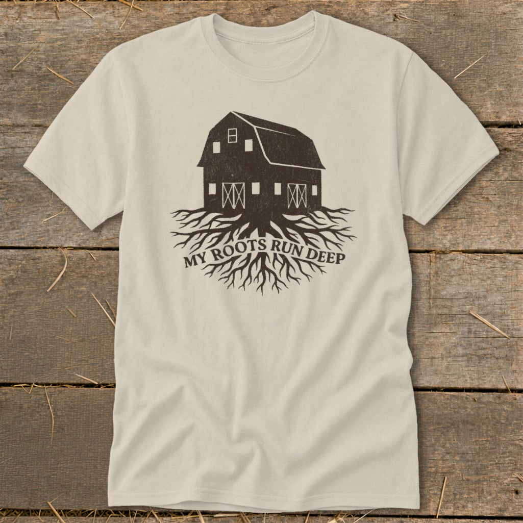 Light cream t-shirt with dark brown barn and roots graphic. "MY ROOTS RUN DEEP" text.