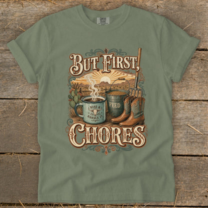 "But First, Chores" graphic tee with coffee, feed bucket, boots, and desert scene.
