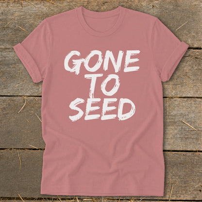 Pink t-shirt with white text that reads "GONE TO SEED"