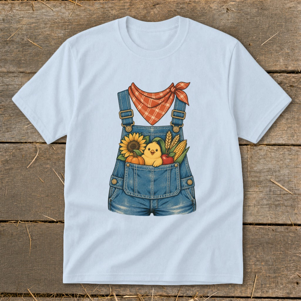 Light blue t-shirt with cartoon overalls, chick, sunflower, pumpkin, corn, and apple graphic.