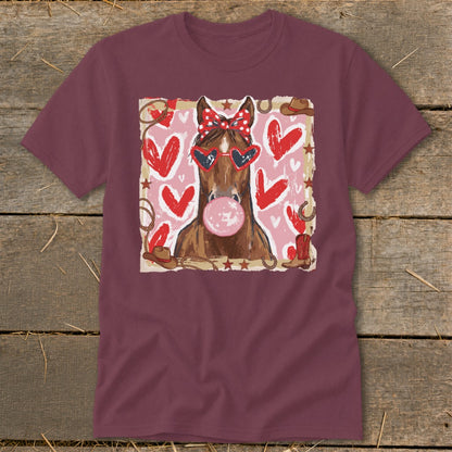Brown horse with sunglasses and bandana blowing bubblegum surrounded by hearts.